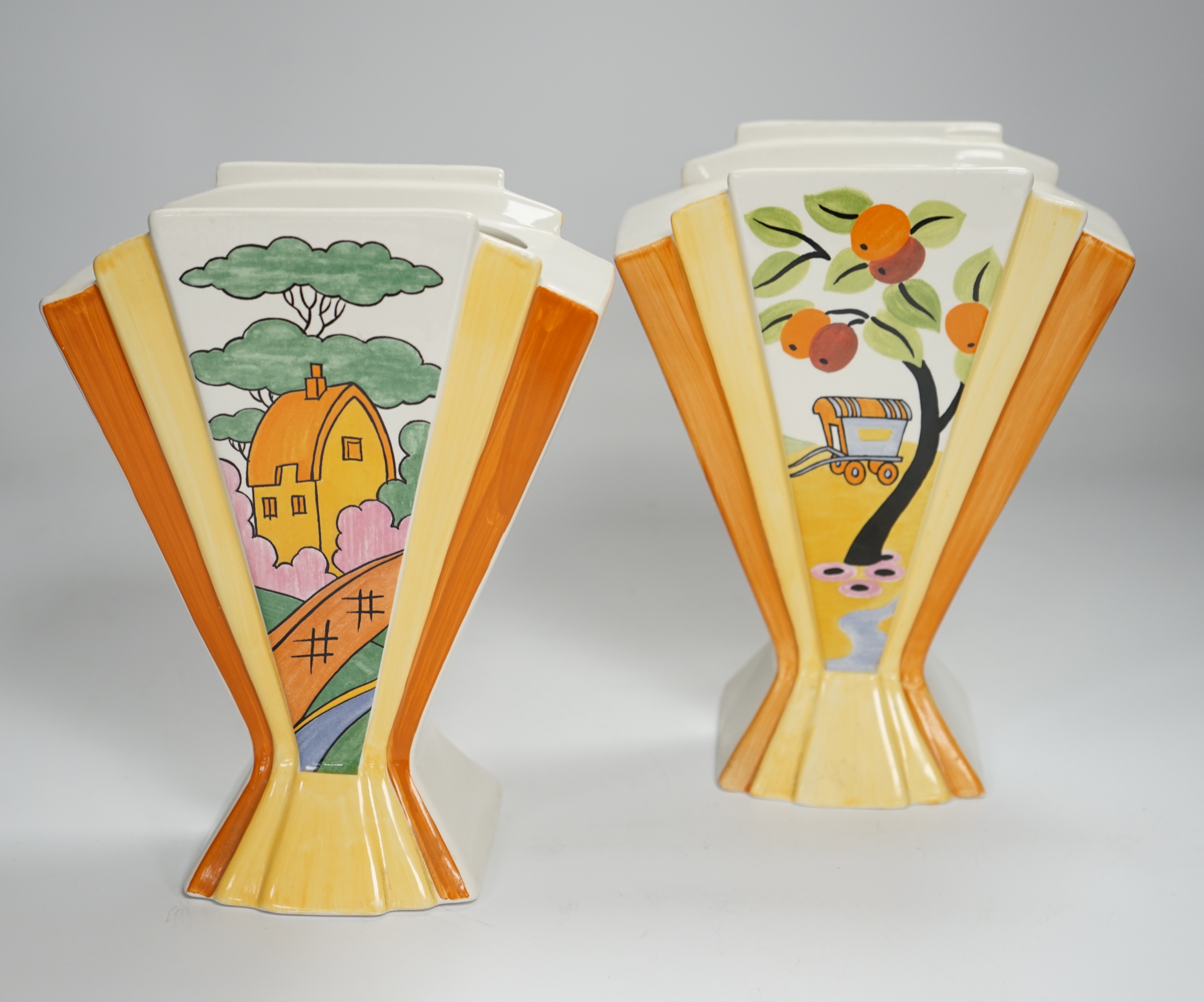 Two modern copies of Clarice Cliff Sunray vases; Caravan and Orange Roof Cottage, 21cm